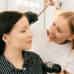 Makeup artist applying eyebrow tint