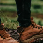 Close-up of brown leather boots outdoors